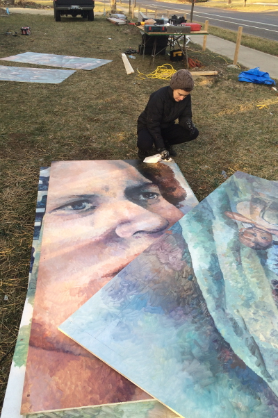 Nicole Macdonald working on the Mary Ellen Riordan mural