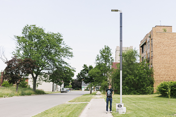 Soulardarity founder Jackson Koeppel next to a solar-powered streetlight