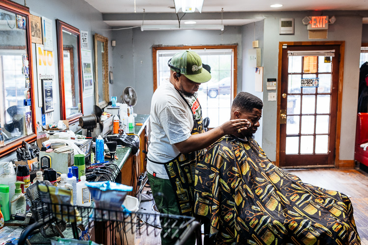 David Hardin Jr. cuts a customers hair