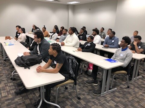 Students listen during a class at NPower.