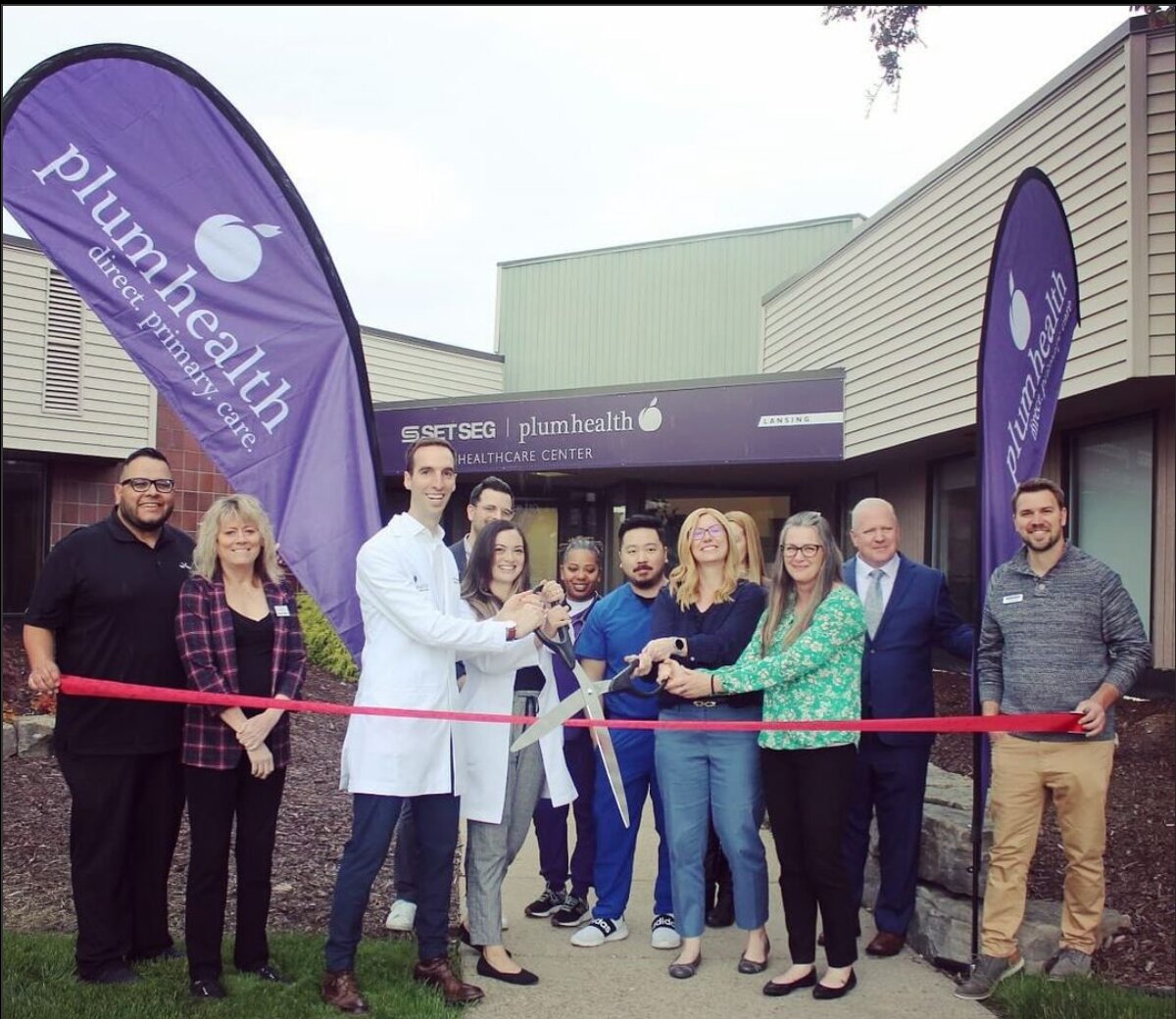 Plum Health employees celebrate the opening of its Lansing branch earlier in 2024.