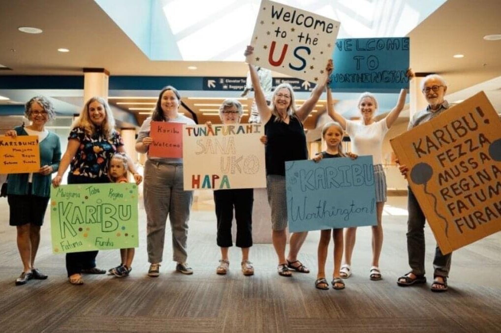 A private sponsor group prepares an airport welcome for a new Welcome Corps refugee