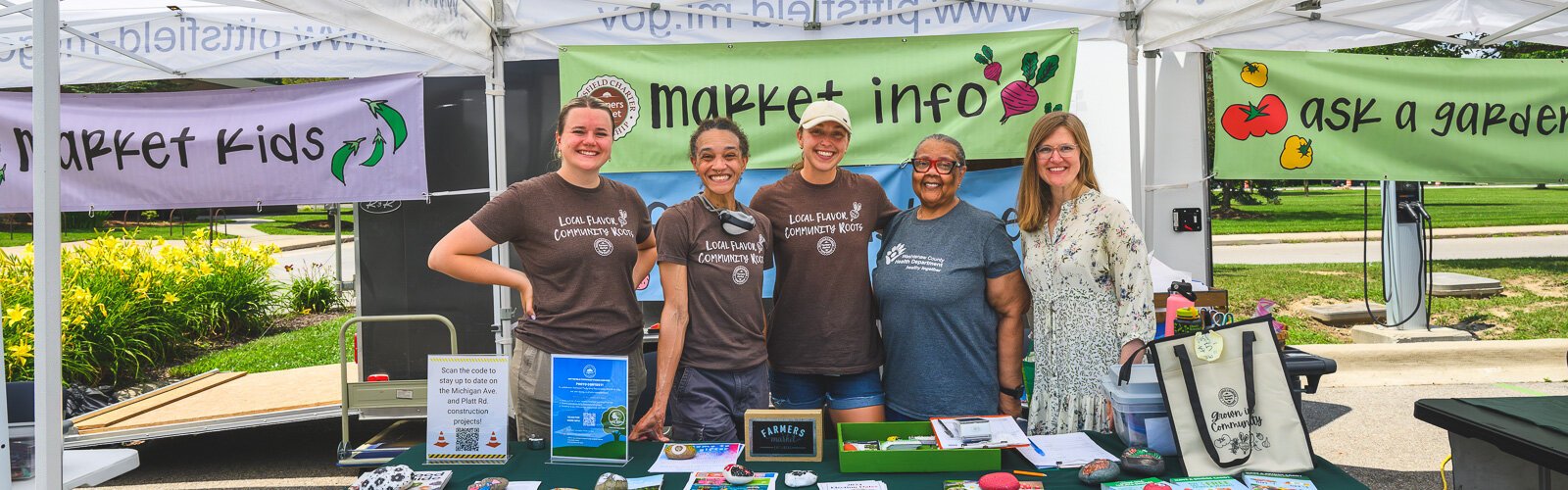 Bridget Smith, Tanya Andrews, Ashleigh Donahey, Anne Davis, and Ariane Donnelly at the Pittsfield Township Farmers Market.