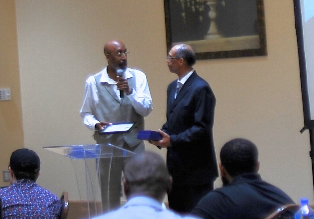 John Miles, facilitator of The Children’s Center’s Fatherhood Initiative program, speaks in June at an annual Fatherhood Forum sponsored by the Detroit Wayne Integrated Health Network