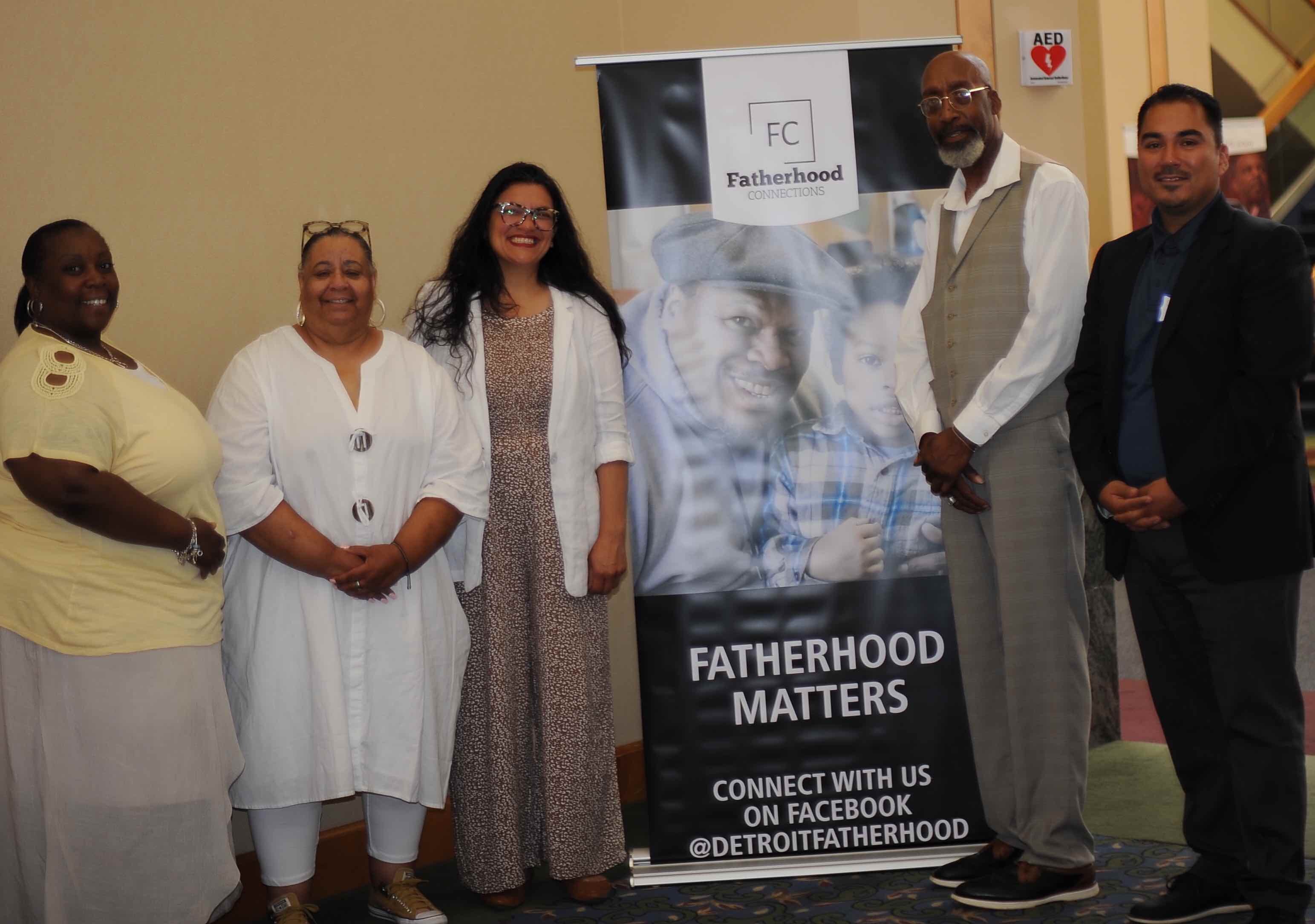 At second from right, John Miles, facilitator of The Children’s Center’s Fatherhood Initiative program, poses in June with other organizers at an annual Fatherhood Forum sponsored by the Detroit Wayne Integrated Health Network