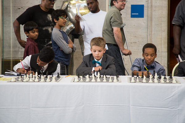 Young Detroit chess players compete against international master