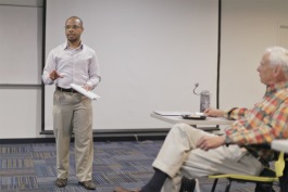 Chase Cantrell, founder of Building Community Value, speaks during a session of Better Buildings, Better Blocks