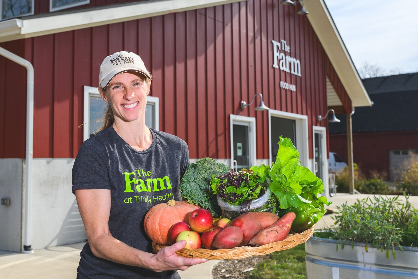 Jae Gerhart, manager of farm programs for Trinity Health Ann Arbor, at The Farm at Trinity Health in Ypsilanti. The Farm offers a produce prescription program for those who struggle to afford healthy food.