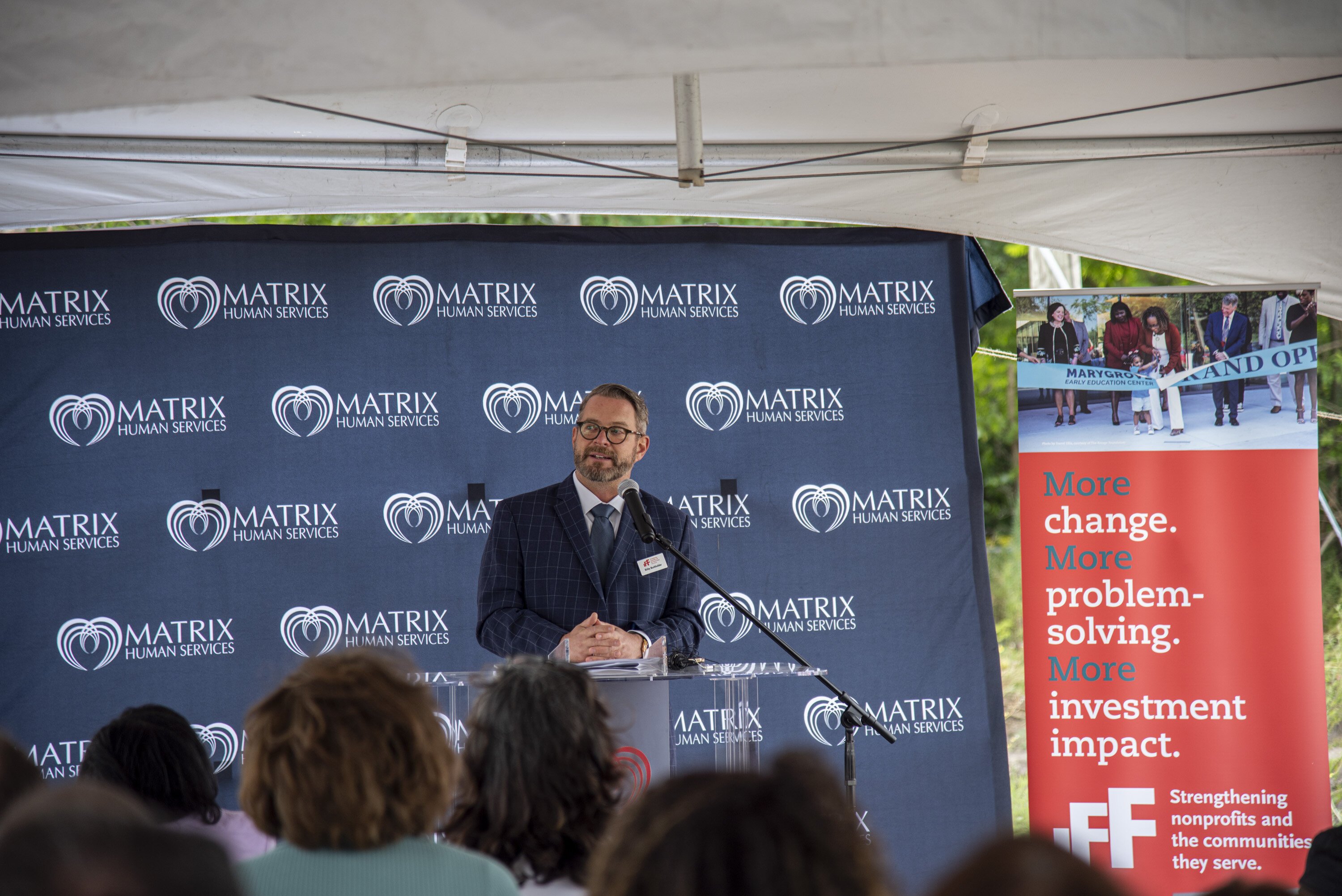 IFF President of Core Business Solutions, Kirby Burkholder, speaks about the CDFI's commitment to neighborhoods in the Eastside of Detroit, at the McClellan Early Childhood Center's ribbon-cutting ceremony. 