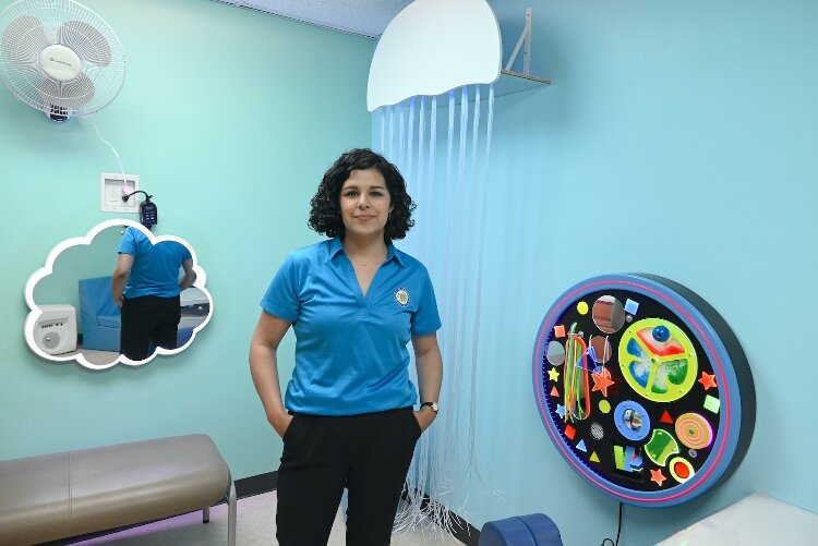 Lyric Anderson, program support specialist for the Calhoun County Public Health Department, stands in the sensory room.