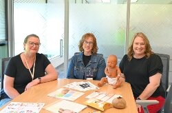 Molly Brouwer, infant and family specialist; Bethany Vukusic, Maternal Infant Health Program team su