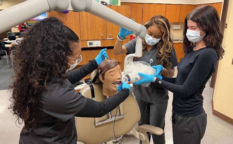 Students receive dental hygiene training through the Warren Arts & Education Foundation program.