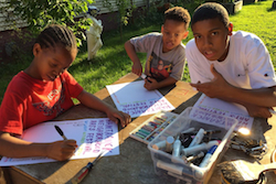 List Youth brigade from Hamtramck Free School working on posters