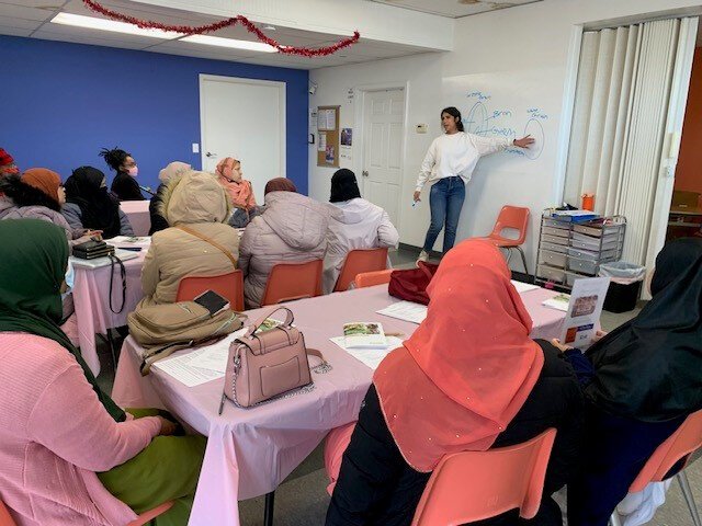 Sara Skar, Program Coordinator at Gleaners Community Food Bank of Southeastern Michigan, conducts a Cooking Matters Class at Friendship House 