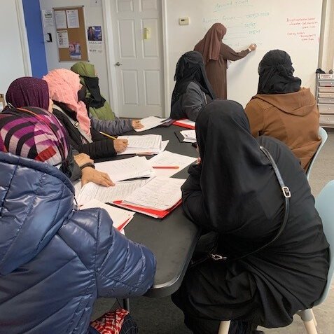 English Instructor Saida Tanzim teaching a women’s empowerment group at Friendship House