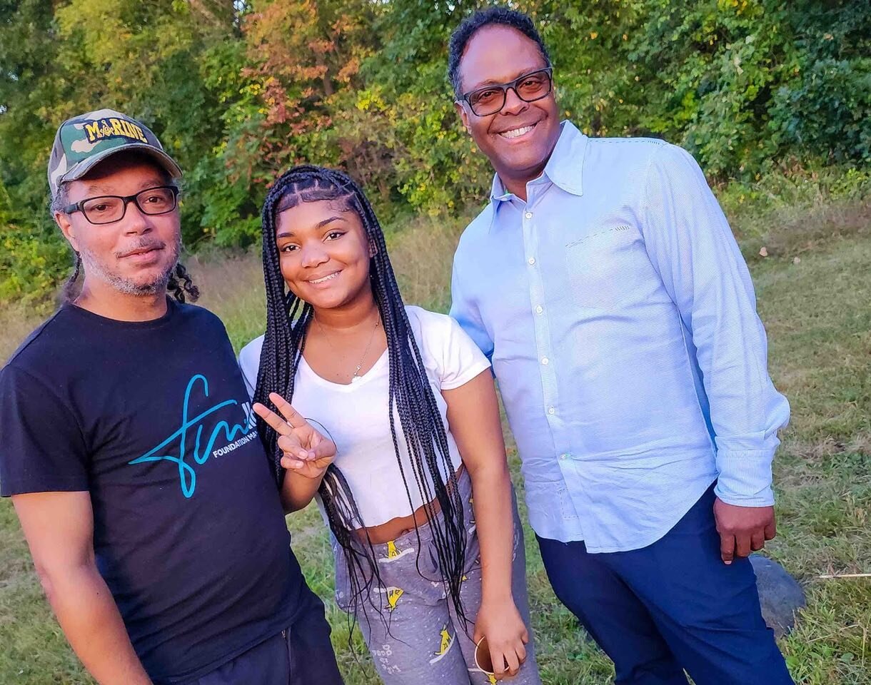 Marlin Franklin (left) with his granddaughter and first-time camper Jayla and Interim Chief of the Detroit Police Department Todd Bettison